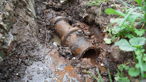Leak in water pipe. Plumber service. Broken sewer